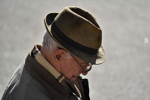 wrinkled grandfather eyeglasses jacket hat face wrinkle serious