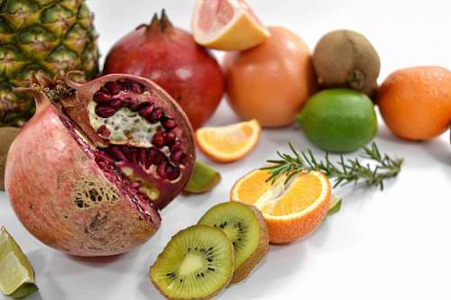 grapefruit grapefruit kiwi fruit fresh slices pomegranate pineapple mandarin exotic ripe seed  fruits
