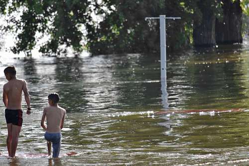 swimsuit lakeside swimsuit boys lake recreation flood landscape water shore swimming child wet jumping splash jump