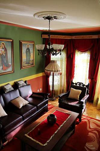 arts-culture-and-entertainment living curtain fine interior armchair chandelier couch sofa arts painting salon  indoors furniture lamp