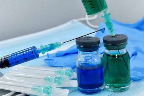 syringe medical care syringe healthcare treatment latex gloves mask face pharmacology cure