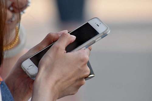 mobile phone touch technology woman telephone hands skin connection