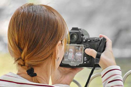 photojournalist hairstyle brunette photographer woman lens camera nature equipment pretty