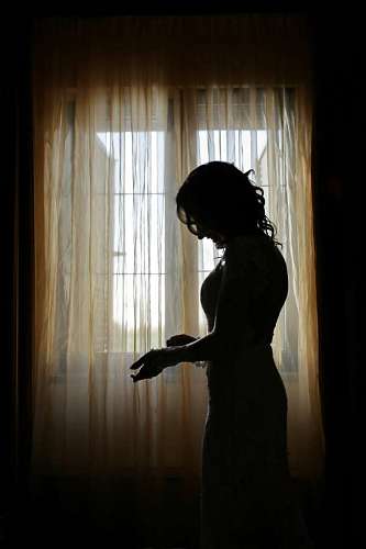slim silhouette shadow slim pretty alone standing curtain window 