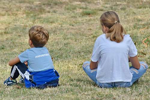 sister sister relaxation boy countryside brother togetherness grass nature child