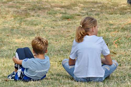 sister sitting grass park boy child sister happy nature happiness kb eus ikasbil