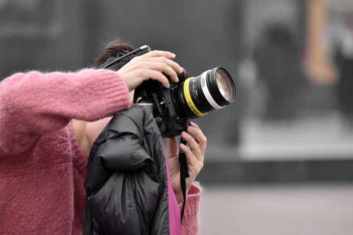 snapshot snapshot lens sweater photographer professional camera equipment portrait woman 
