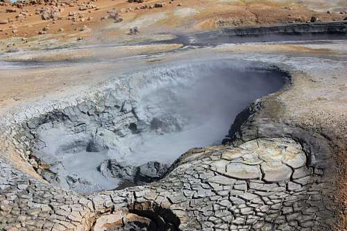 volcano volcano geyser eruption volcanic crater landscape geology island smoke rock rocks ocean sky coast sea 