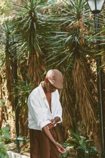 nature Brazilian Man Rolling Up His Shirtsleeves ? Casual and Ready for Action


