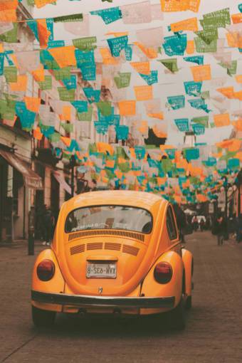 car Yellow VW Beetle in the City of Puebla, Mexico ? Classic Car in Urban Setting
