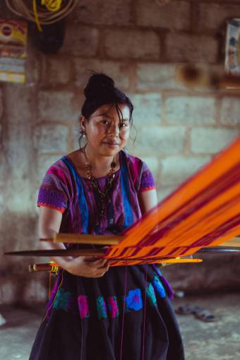 one-young-woman-only Woman Weaving on a Loom in Mexico ? Traditional Textile Craftsmanship
