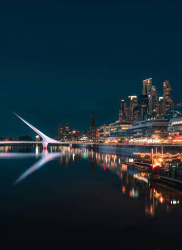 monument Puerto Madero and Woman Bridge at Night in Buenos Aires ? Illuminated Urban Waterfront
