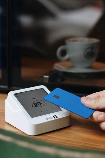 car Person Making a Contactless Payment with Credit Card
