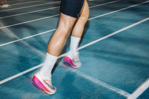 car Powerful Legs of an Athlete Running on Track