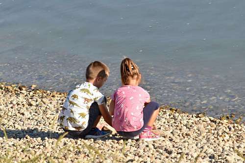 sister beach brother sister child fun childhood water parent sand