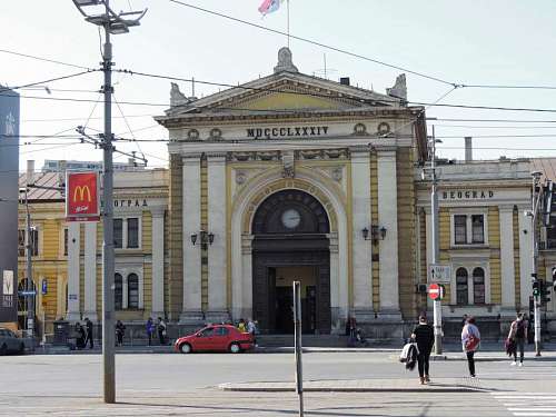 arch-architectural-feature capital crowd building serbia railway station arch urban street