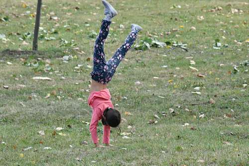 50s child physical activity jumping pretty active children daylight childhood headstand 