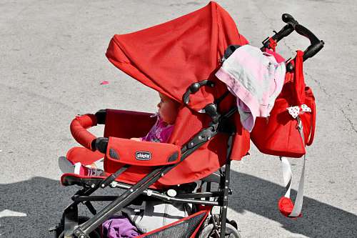 cart-road fun innocence pavement young baggage child bags street