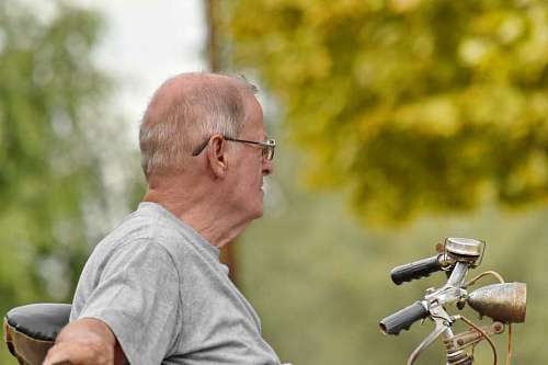 pensioner outdoors senior pensioner relaxation eyeglasses bicycle nature leisure side sus  abuelo dinero pagar tiene beard handsome smile face
