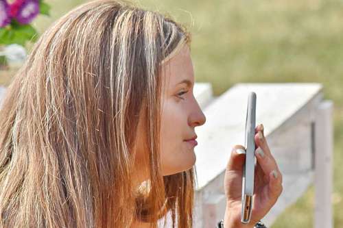 phone relaxing woman hairstyle casual mobile pretty hand sunshine person summer