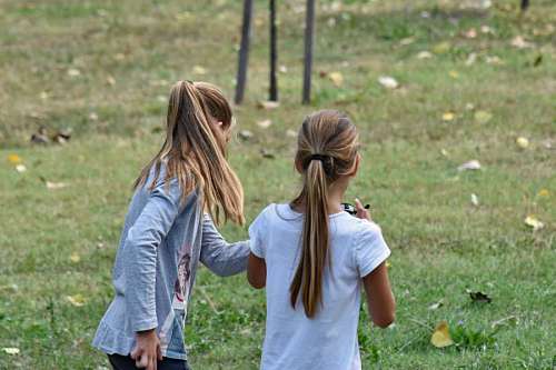 sister playing child park teens cheerful sisters outdoors together 