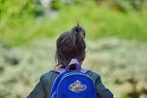 schoolgirl schoolgirl backpack child summer nature fun outdoors grass walking  walked