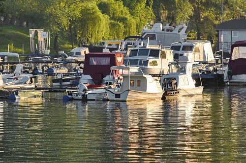 shed shed boathouse sunset boat building watercraft reflection river vehicle water