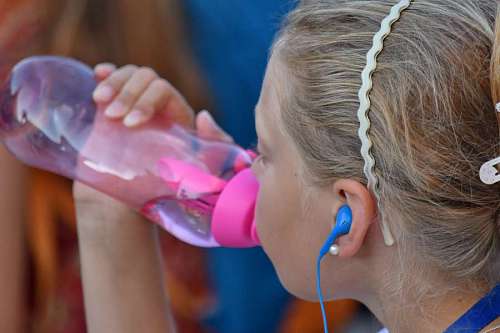 sister water drinking pretty child bottled fun nature children boy childhood brother sister playing kb