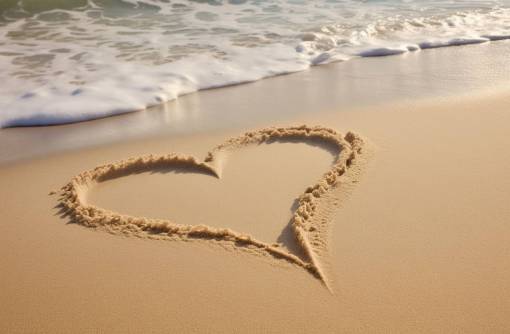 love Heart drawn in the sand in the beach