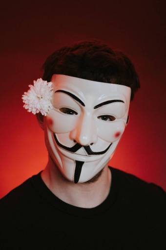 background Man with anonymous mask and a flower