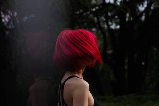 sunset Young woman with reddish hair at sunset