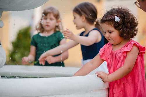 girlfriend adorable children playful fountain girlfriend happy 