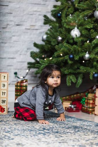 kids Little girl by the Christmas tree