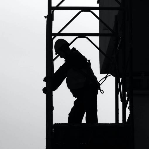 hard construction worker occupation working construction industry men back lit silhouette
