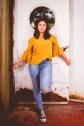 one-young-woman-only Latin young woman posing and looking at the camera