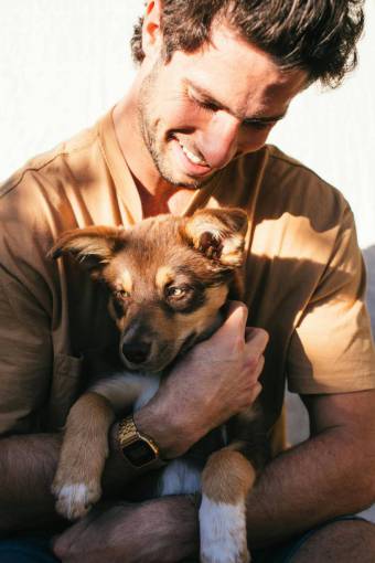 love Young man hugging a puppy