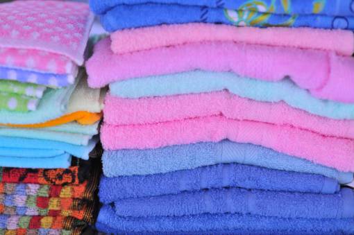 pattern textile clothing stack folded multi colored towels towel