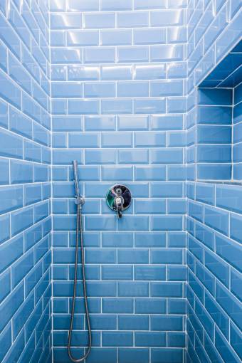 tile indoors bath;blue tiles;bathroom domestic room modern building feature blue wall
