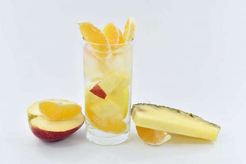 crystal-clear-water fruit mandarin juice cocktail crystal apple ice slices pineapple drink glass