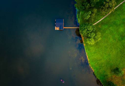 roof aerial  view  green  grass  trees  blue  lake
