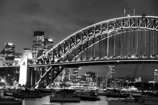monochrome city  bridge  night  buildings  boats  water  lights