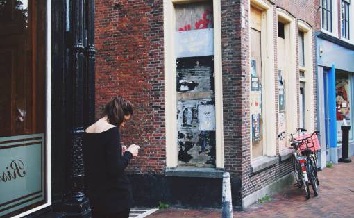 sidewalk girl  woman  texting  people  city  urban  bricks