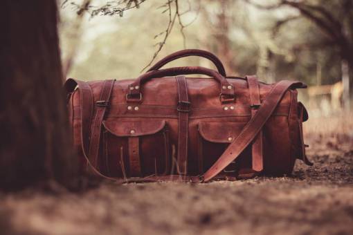 leather handbag  leather  brown  blur  tree  nature
