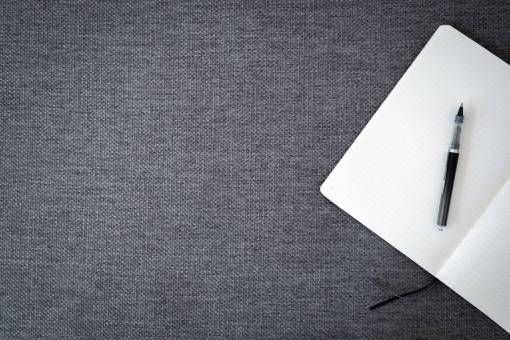 oficina cuaderno de papel vista superior espacio de trabajo plano laico escritura