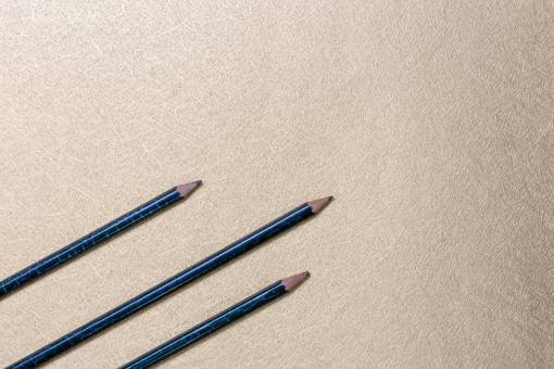 sketch pencils  flat lay  background  gold  shiny  texture  objects