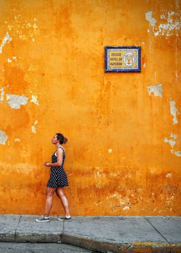 sidewalk people  woman  street  orange  color  wall  sidewalk