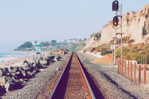 trail train  station  rail  trail  stoplight  water  ocean