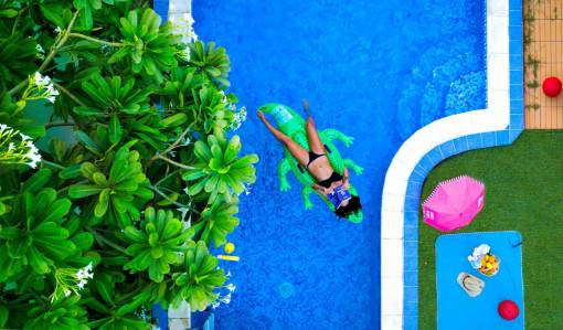 chill woman  pool  blue  crocodile  nflatable  tree  green