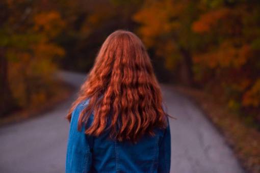 girl redhead girl walking in autumn