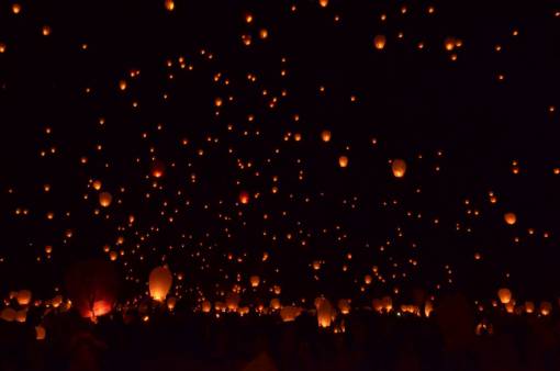 asian-and-indian-ethnicities Lanterns lit in the night sky